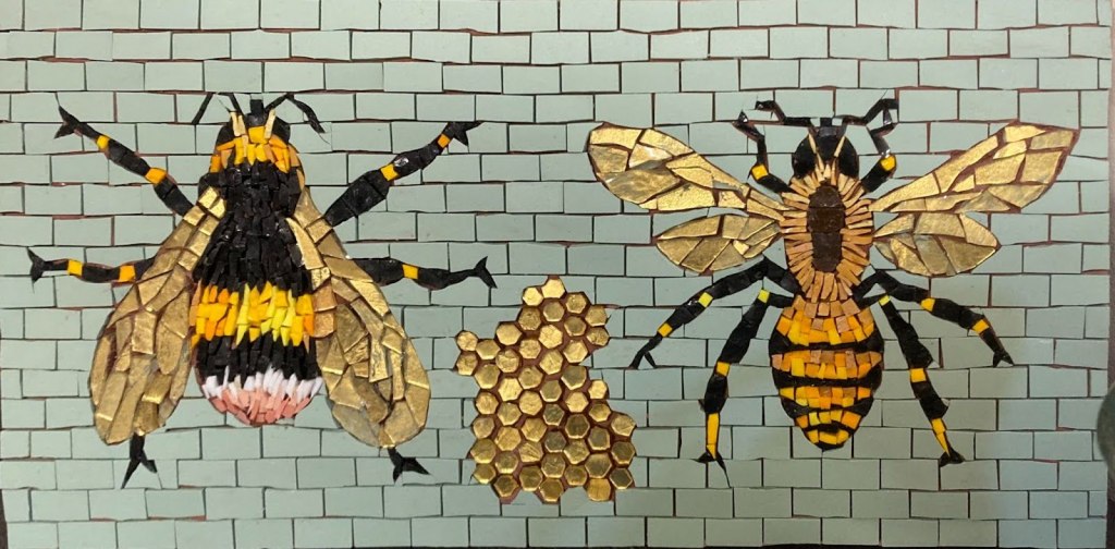 A mosaic of two bees